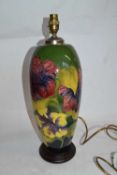 An impressive Moorcroft lamp base, the green ground decorated with Hibiscus, 40cm high Good
