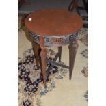 An Edwardian mahogany lamp table with circular top, tapering legs and X formed stretcher, top 53cm