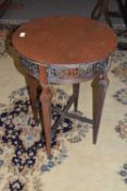An Edwardian mahogany lamp table with circular top, tapering legs and X formed stretcher, top 53cm