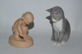 A Copenhagen Bing & Grondhal model of a cat together with a terracotta model of a young girl with