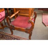 A Victorian oak framed large stool or window seat with scrolled side arms, 70cm wide