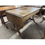 19th Century mahogany sofa table with drop leaves and two drawers with ringlet handles, 106cm wide