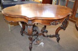 Victorian rosewood centre table raised on scrolled legs with an X formed stretcher, 135cm wide