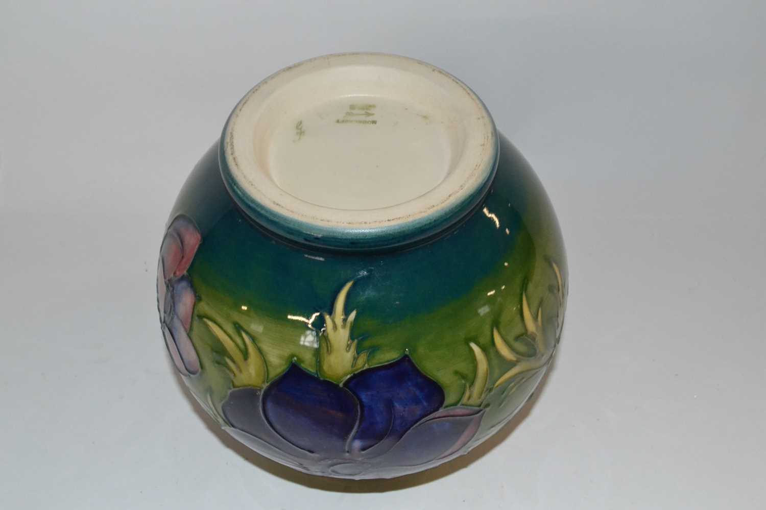 A Moorcroft vase of globular form, the green ground with tubelined Anemone design - Image 2 of 2