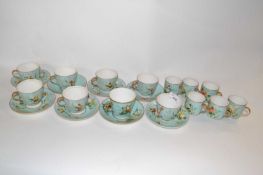 A 19th Century part tea set, cups and saucers and coffee cups, the light green ground decorated with