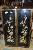 A pair of contemporary Oriental black lacquered panels decorated with foliage, 20cm high