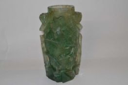 A Chinese carved quartz vase decorated in relief with carved flowers, 17cm high