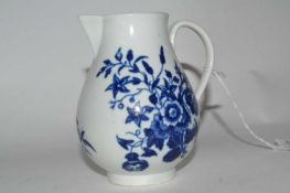 An 18th Century Worcester sparrow beak jug with an underglaze blue design, 9cm high