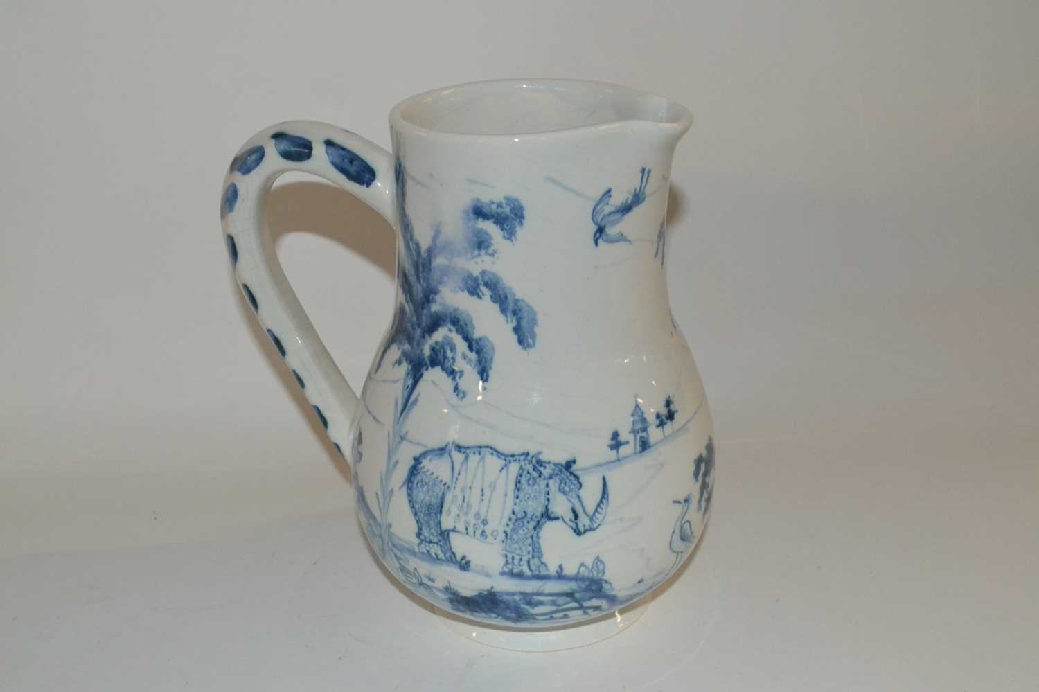 A Isis Ceramics type jug decorated with a camel and a monkey in Delft style, slightly crazed, - Image 3 of 3
