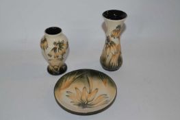A group of modern Moorcroft wares with the Cornflower design including two small vases and a pin
