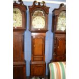 Edward Radford, Skelton, a large Victorian long case clock with arched dial painted with classical