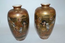 Pair of Japanese Satsuma vases, Meiji period, decorated with Sages (one a/f), 15cm high
