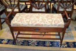 Late Victorian duet piano stool with floral upholstered lifting top, turned side handles and a