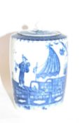 An 18th Century Caughley tea caddy and cover decorated with the fisherman print in blue, 12cm high