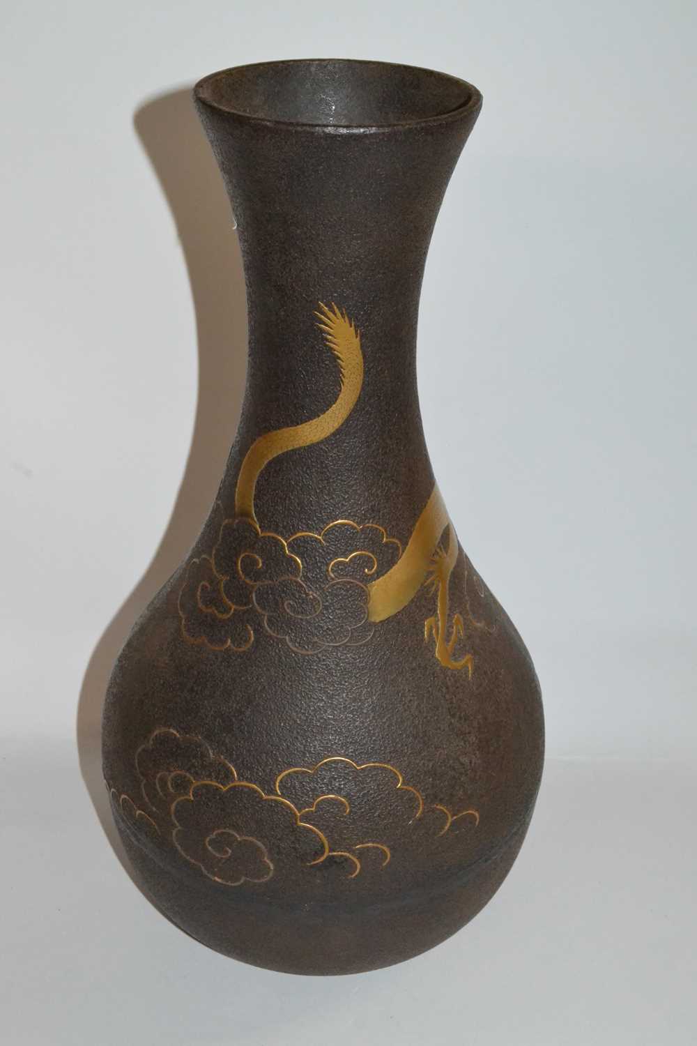 A Japanese iron vase of baluster form decorated in relief in gilt with a sinuous dragon amongst - Image 2 of 3