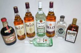 Three bottles of Bells whisky, two bottles of Bacardi, and one bottle of Cointreau, Drambuie and