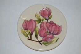 A Moorcroft dish in the Magnolia pattern 26cm diameter