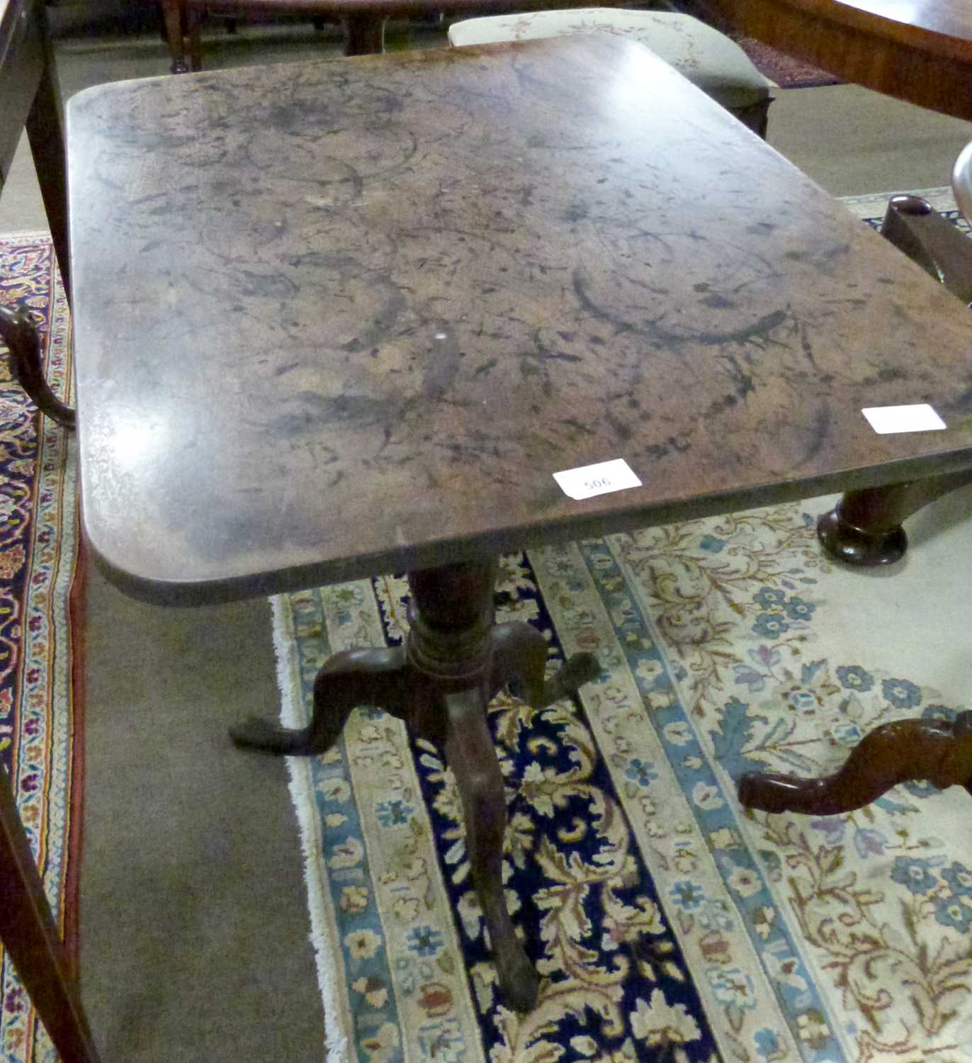 A Georgian mahogany tripod based flip top table with rectangular top and a turned column, height