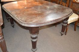 Victorian mahogany extending dining table with rounded ends, raised on turned and fluted legs, 140cm