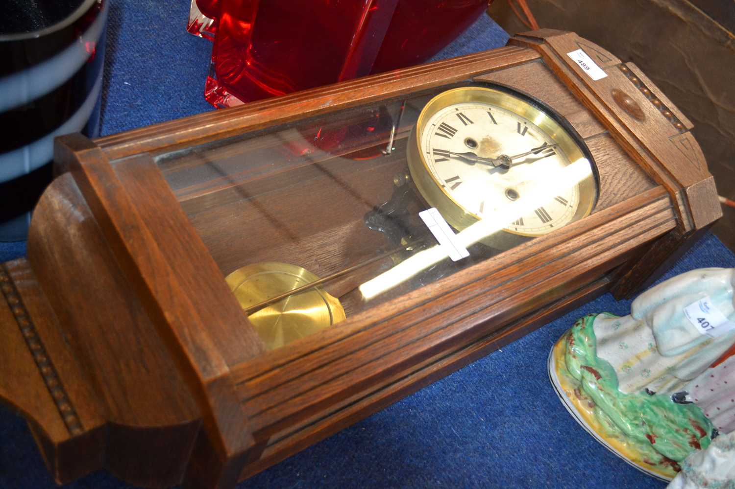 A 20th Century oak cased wall clock with unsigned silvered dial, 60cm high maximum
