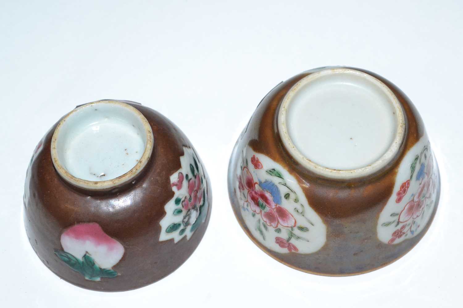 A pair of Chinese Batavia tea bowls, probably 18th Century, the cafe au lait ground with famille - Image 3 of 3