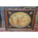 A 19th Century needlework picture of three ladies in a country landscape set in an oval surround and