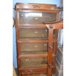 A Globe Wernicke oak four tier stacking bookcase with drawer to base 90cm wide