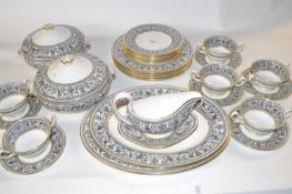 A Wedgwood Florentine pattern dinner service comprising two large oval serving dishes, gravy boat
