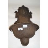 Small cast iron wall mounted water fountain with lion mask decoration, approx 60cm high