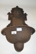 Small cast iron wall mounted water fountain with lion mask decoration, approx 60cm high