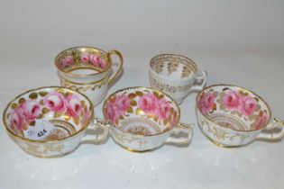 Group of five English porcelain cups, all painted with roses in Coalport style, some with retailer