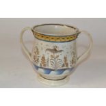 A Leeds type pottery two handled loving cup, early 19th Century with floral and chinoiserie