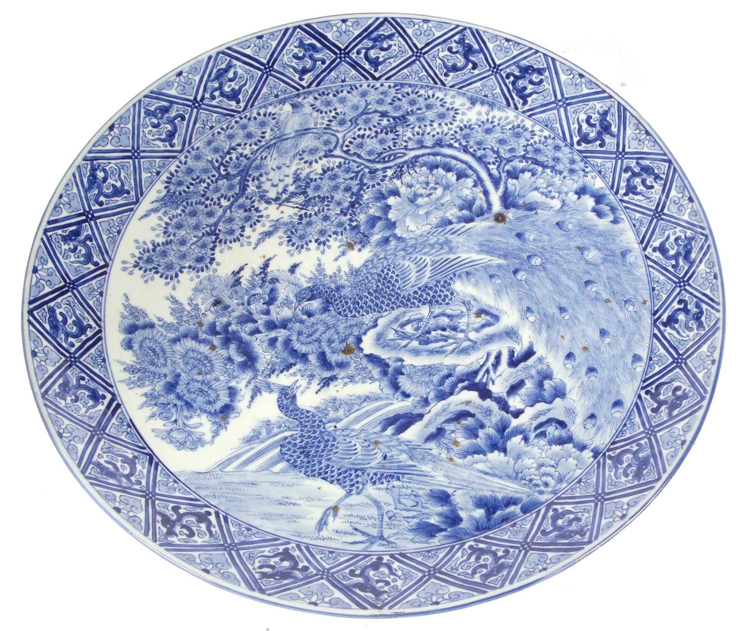 A large Japanese charger, Meiji period decorated in underglaze blue with exotic birds amongst - Image 2 of 5