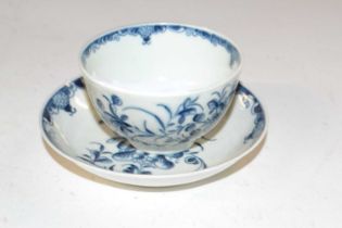 A Lowestoft porcelain tea bowl and saucer with blue and white design