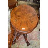 A Victorian walnut veneered and inlaid small centre table with oval top, four turned supports and