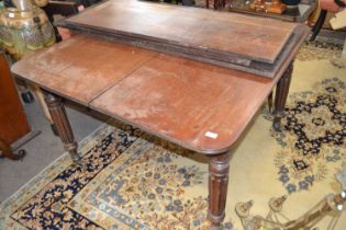 A large Georgian mahogany extending dining table for restoration, 117cm wide, the leaves adding a