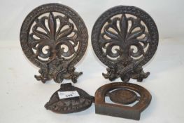 Mixed group of small iron plaques comprising a pair of pierced form with easel backs, further