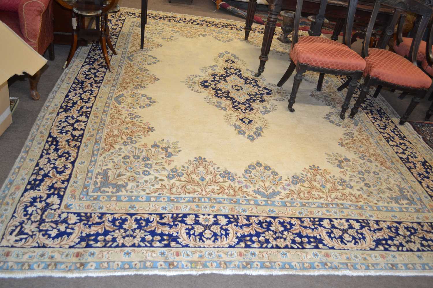 A modern Kirman beige wool floor rug with geometric and floral border, 3.58 x 2.70 metres