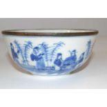 A further 19th Century Chinese porcelain bowl with blue and white decoration of figures and metal