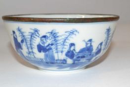 A further 19th Century Chinese porcelain bowl with blue and white decoration of figures and metal