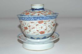 A Chinese porcelain rice bowl cover and stand, 19th Century with four character mark to base and