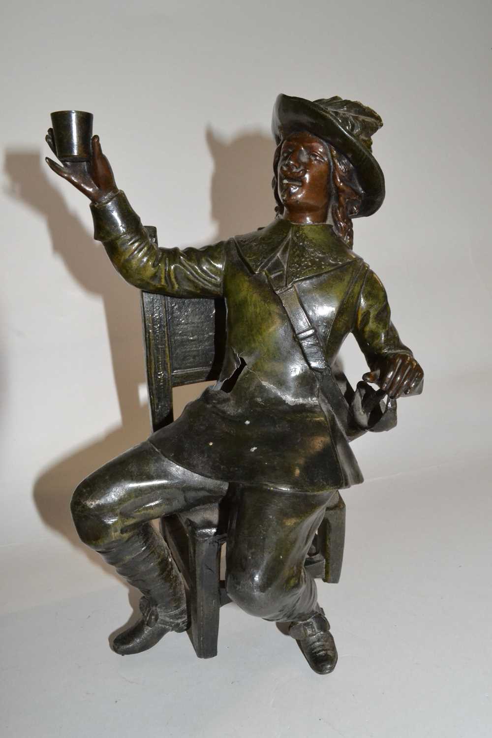 Two bronzed Spelter figures, one of a Cavalier seated and a further gentleman seated smoking a pipe, - Image 2 of 3