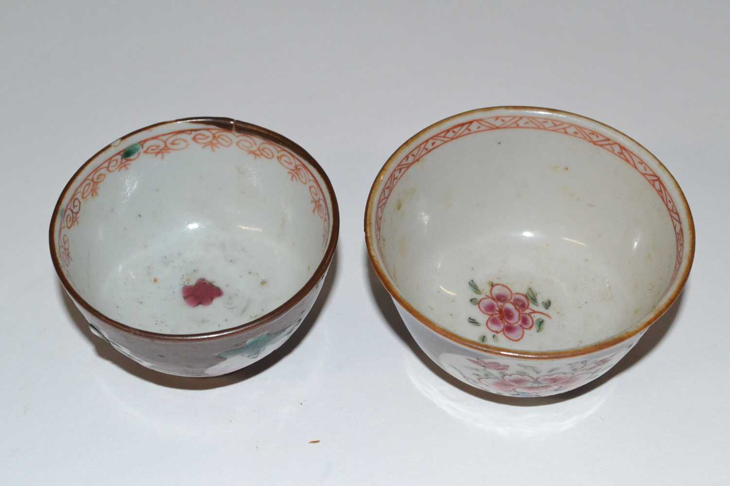 A pair of Chinese Batavia tea bowls, probably 18th Century, the cafe au lait ground with famille - Image 2 of 3
