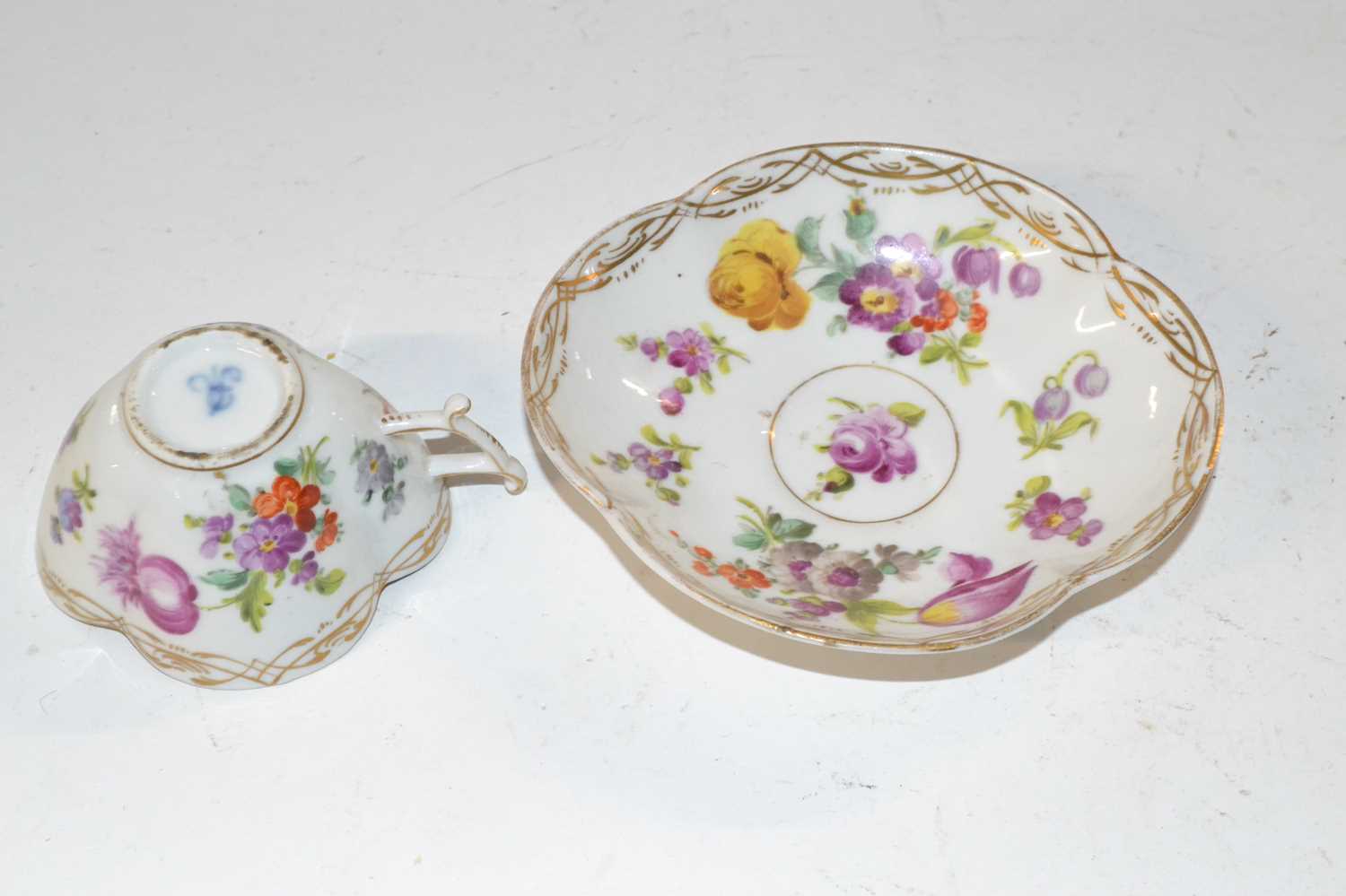 A 19th Century Dresden cup and saucer of quatre lobe form decorated with flowers, blue AR mark to - Image 2 of 3