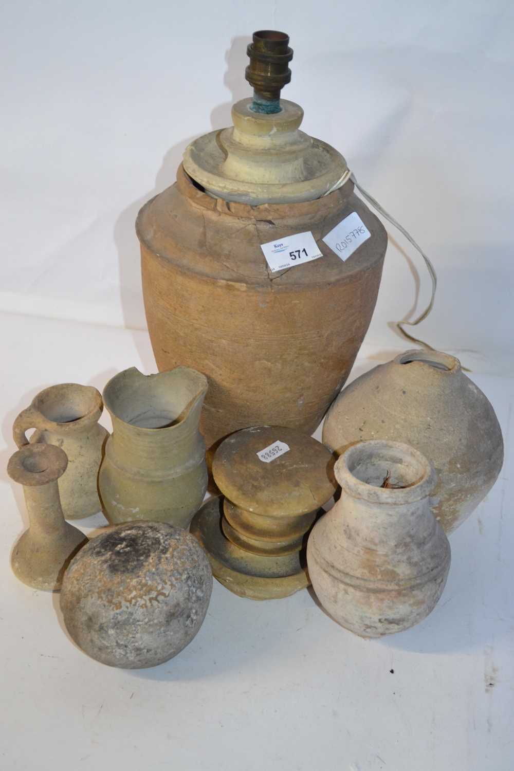 A group of various antiquities likely of Middle Eastern origin to include a range of small vases,