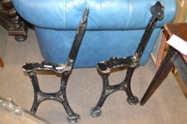 A pair of cast iron bench ends, the legs marked John Heywood, approx 77cm high