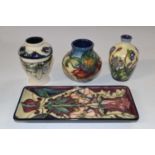 A group of modern Moorcroft wares, all with typical tubelined designs including a small