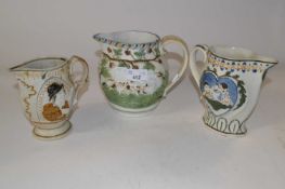 A group of three early 19th Century Pratt ware jugs (one a/f), all decorated with typical designs in