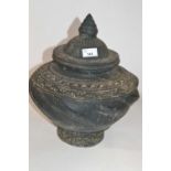 A large pottery jar and cover, possibly Sino-Tibetan, 35cm high