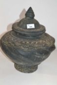 A large pottery jar and cover, possibly Sino-Tibetan, 35cm high